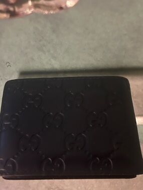 Gucci Black Embossed GG Leather Bifold